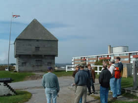 Graduate students listen to lecture at the site of the reconstructed Block House at Fort Howe, Saint John.  Photo by Kevin Norris 2003(c).